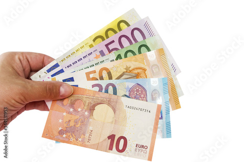 different euros in hand isolated on a white background.