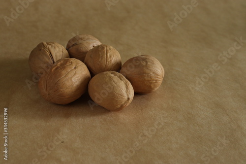 wallnuts in shells on the mono colour background