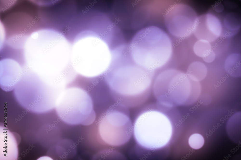 Fototapeta premium Bright violet bokeh lights abstract background