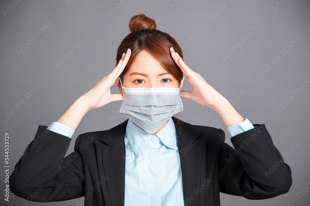 young woman wear medical mask with headache concepts young woman wear medical mask with headache concepts
