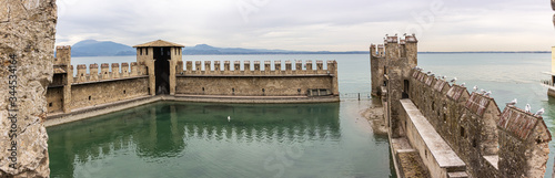 The fortified internal port of the Castello Scaligero fortress in the Sirmione town in Lombardy, northern Italy photo