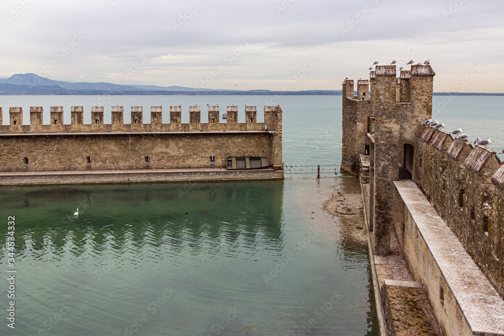 The fortified internal port of the Castello Scaligero fortress in the Sirmione town in Lombardy, northern Italy
