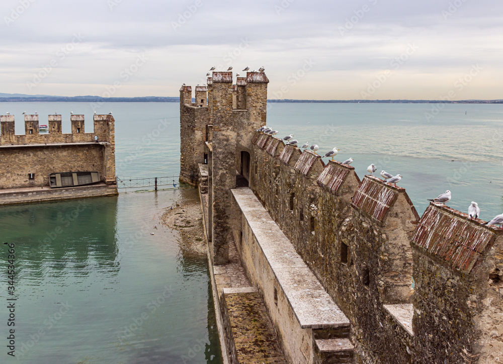 The fortified internal port of the Castello Scaligero fortress in the Sirmione town in Lombardy, northern Italy