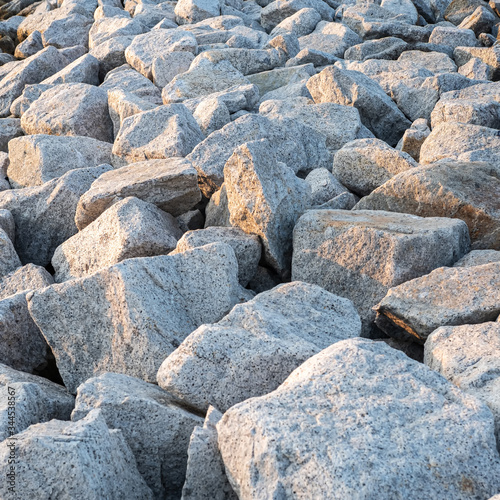 Close up. rock stone breakwater at the pier on the beach. © RPA_studio