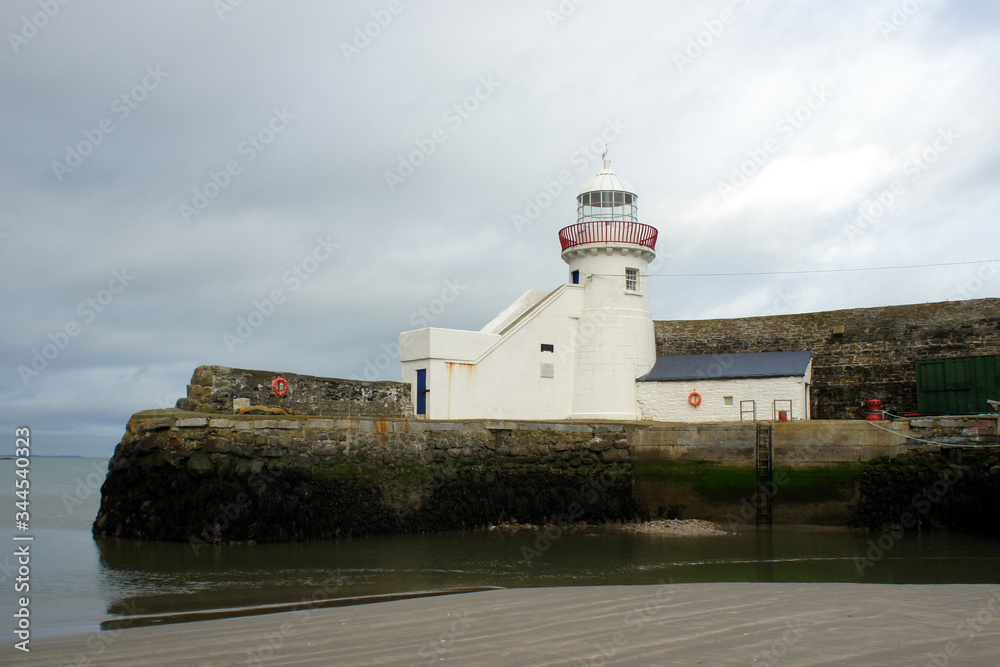 Low tide near the old lighthouse.Ireland. Low tide near the old lighthouse.Ireland.