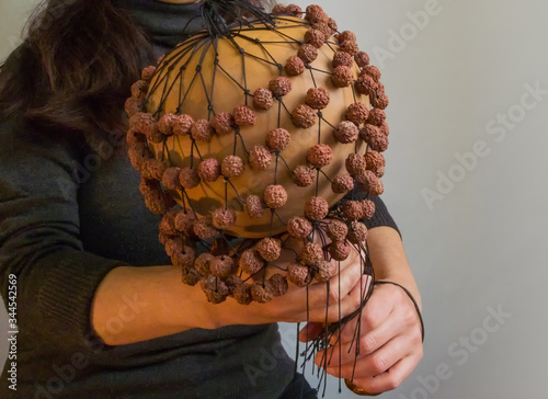 musician woman playing on calabash maracas, Exotic female Performing Hawaiian Music, close-up photography