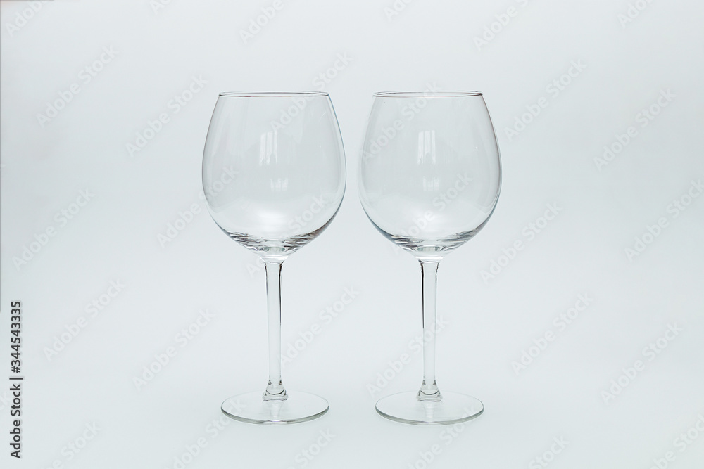 Two glasses for wine on a white background