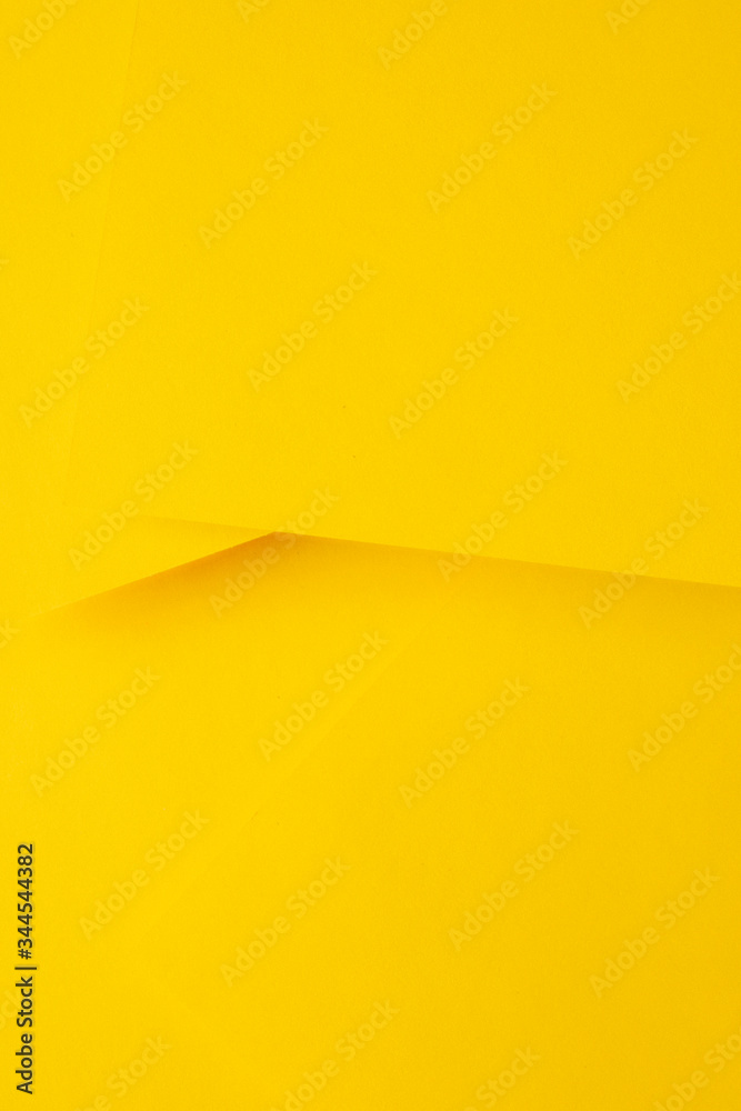 Minimalist layout of bright yellow papers Minimalist layout of bright yellow papers