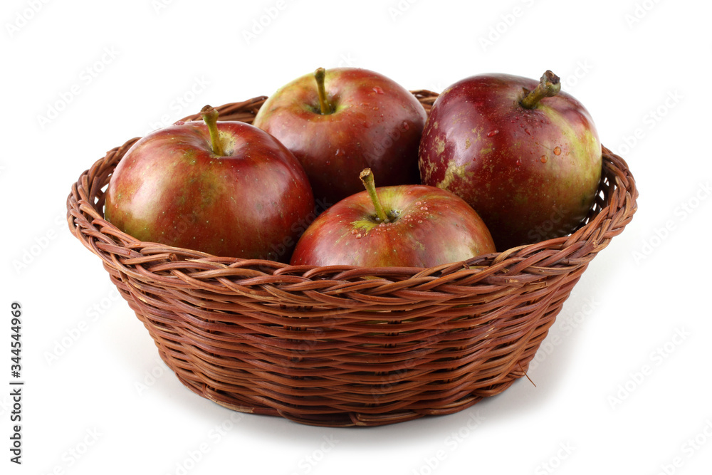 Apples on wicker plate