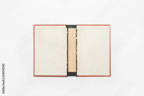 Open hard cover red book on white background, inside hard cover