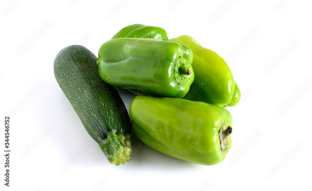 Green peppers and zucchini on a white background Green peppers and zucchini on a white background