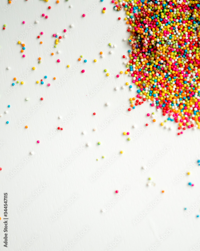 Colourful Sugar sprinkles, decoration for cake and ice-cream and cookies. Top view, Flat lay on white background.