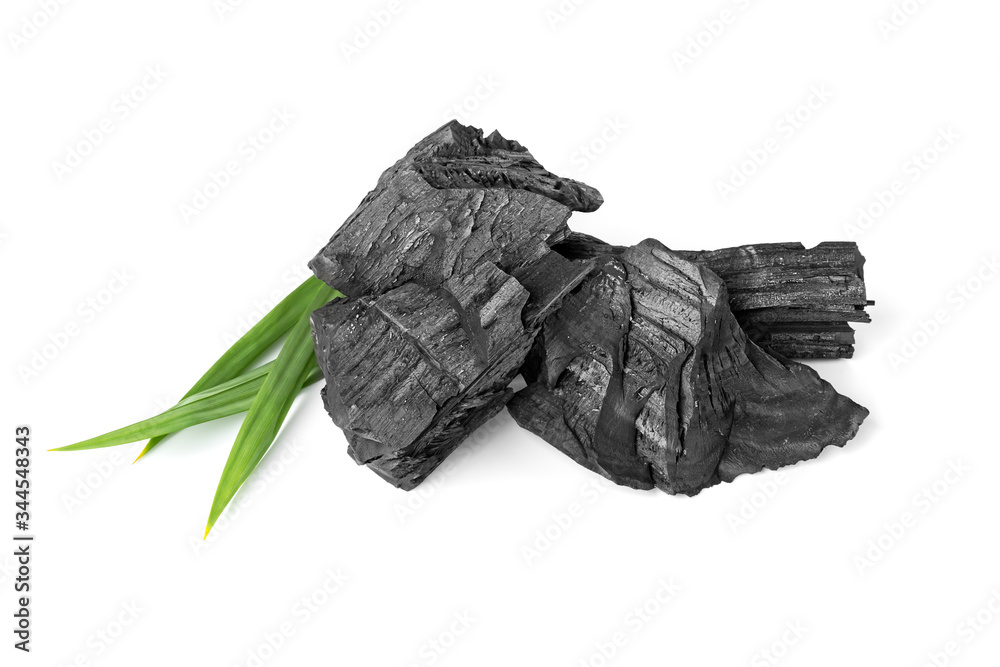 wood natural charcoal with pandan leaf isolate on white background