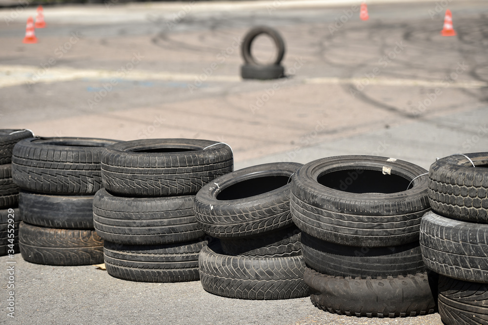 Safety barrier made of used tires inside a driving school polygon Safety barrier made of used tires inside a driving school polygon