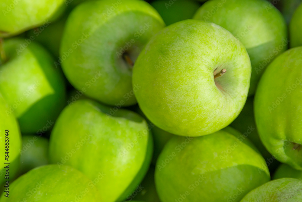 Background of green apples at the local street market. Green apple Raw fruit, healthy ecological organic fresh produce Background of green apples at the local street market. Green apple Raw fruit, healthy ecological organic fresh produce