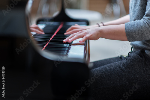 young musician plays the piano