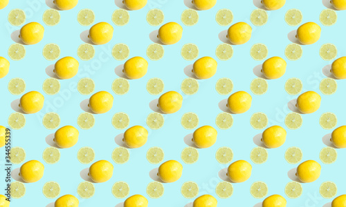 Seamless geometric pattern, sectional lemon and whole citrus on a gentle blue background. Pattern