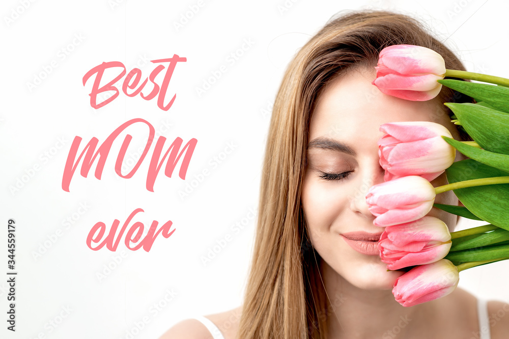Portrait of beautiful smiling woman with pink tulips on white background with text Best Mom Ever.