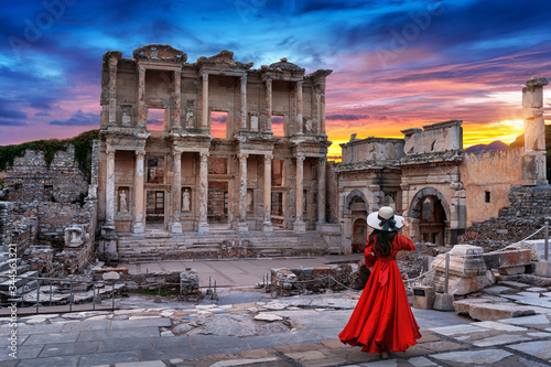 Photography Woman standing in Celsus Library at Ephesus ancient city in Izmir, Turkey
