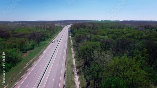 Aerial view of a camera moving along the road going cars where Shot in 4K