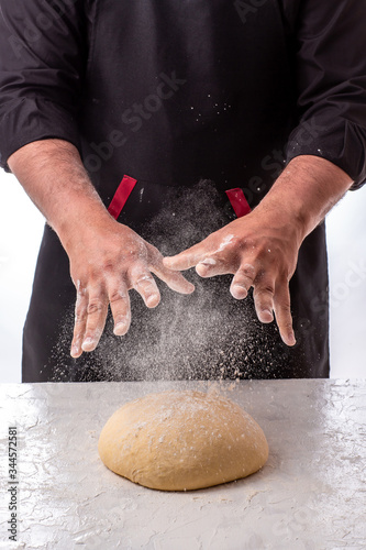 Cooking dough by chef hands for homemade pastry bread, pizza, pasta recipe preparation on table background
