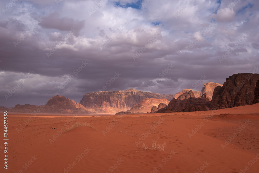 red wadi rum desert in jordan under the dramatic sky