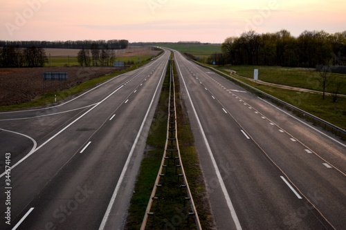 Road for cars in the evening at sunset © Oleg Beliakov