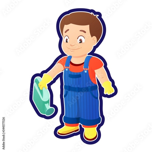 Smiling boy in a denim overall holds watering can