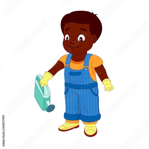 Smiling boy in a denim overall holds watering can