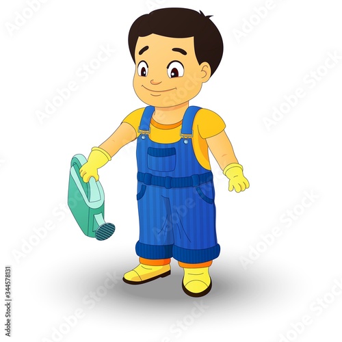 Smiling boy in a denim overall holds watering can