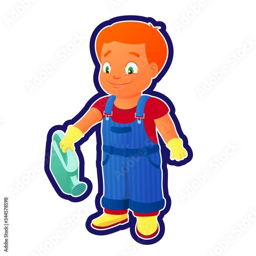 Smiling boy in a denim overall holds watering can