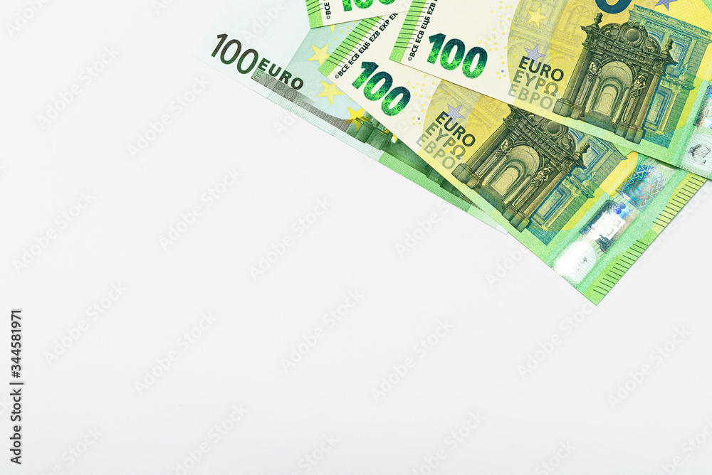 several banknotes of 100 euros on a white background copy space several banknotes of 100 euros on a white background copy space