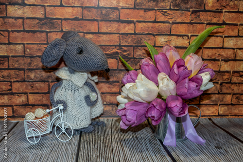 still life, sketch, background, gray, knitted, mouse, in, white, dress, small, decorative, tin, teapot, lilac, satin, ribbon, flowers, lilac, white, tulips, bouquet, decorative, white, braided. Bicycl photo