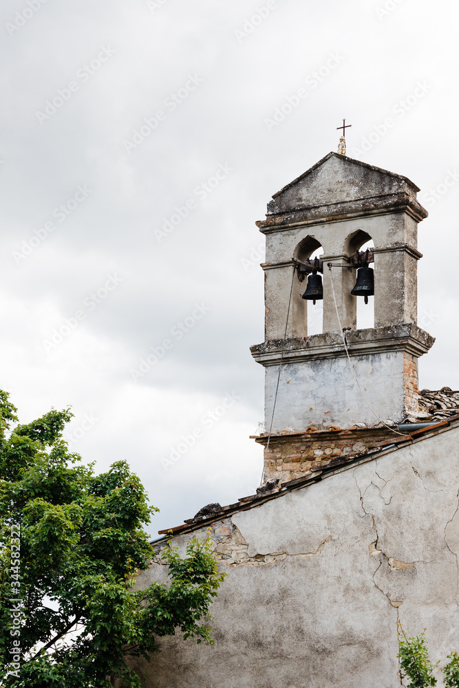 Rustic church bells in an old town in Tuscany, Italy