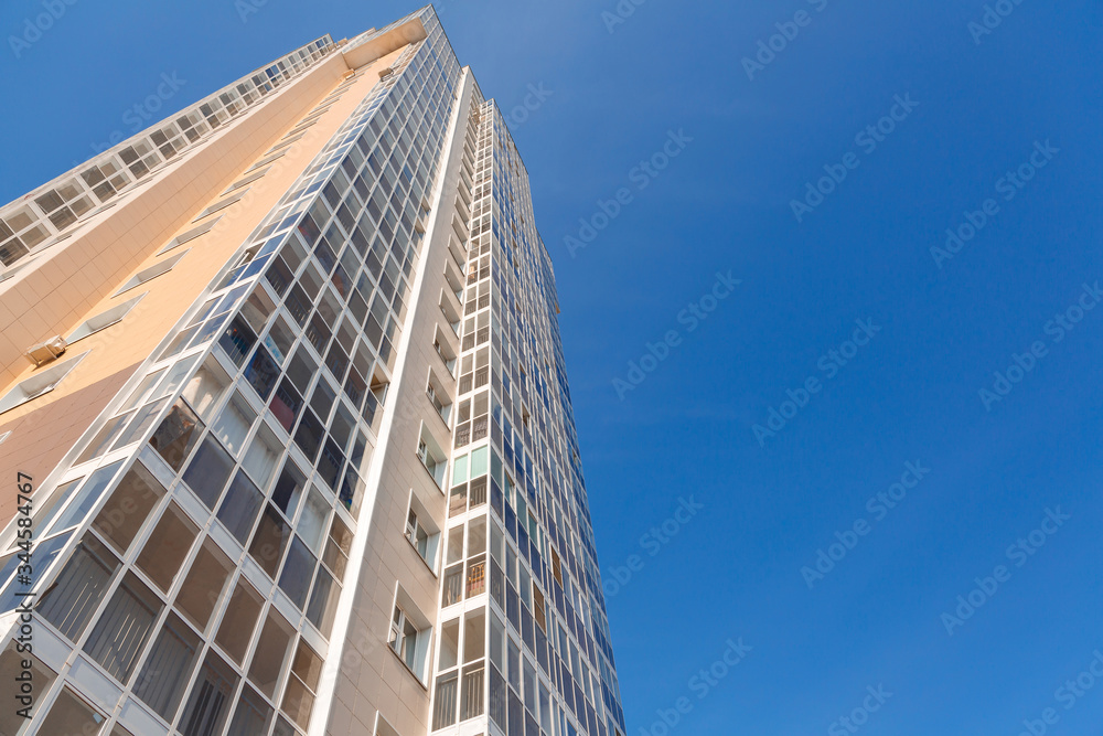 New tall house on a background of blue sky