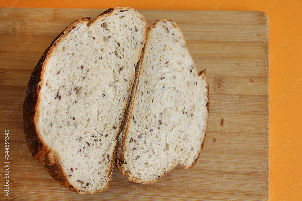 fresh bread with flax cut on a wooden Board fresh bread with flax cut on a wooden Board