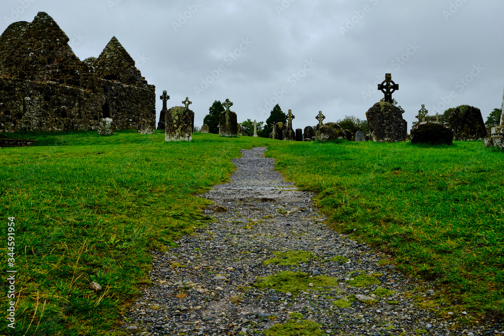 The cemetery in the medieval monastery of Clonmacnoise, Ireland, during a rainy summer day.