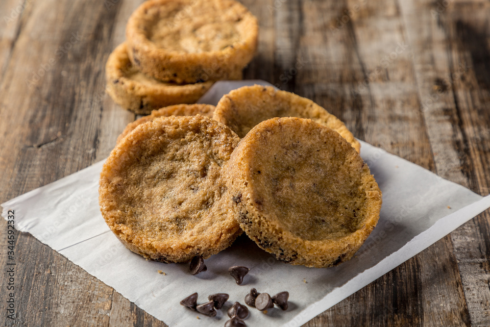 homemade chocolate chip cookies on wooden table homemade chocolate chip cookies on wooden table