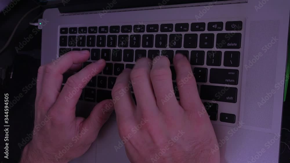 Male Hands typing letter from lateral view with slow shutter speed 4K