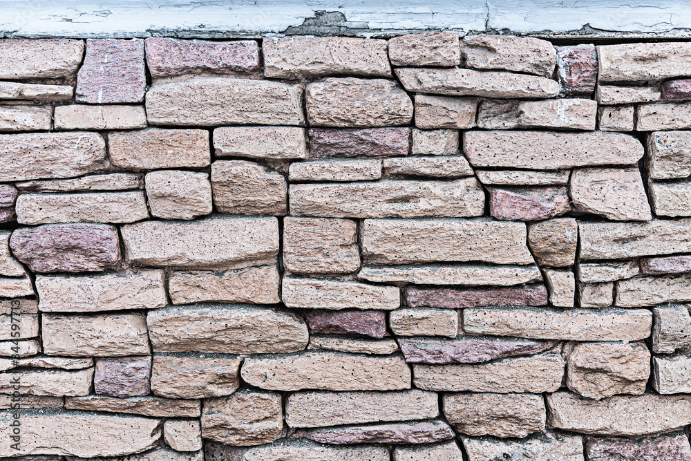 Fototapeta premium Natural stone wall texture background material of industry building construction