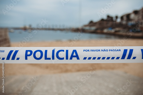Police sign at closed beach