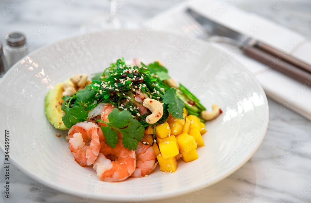 Fresh salad with shrimps.Vegetable salad. Fresh salad with vegetables and nuts. Vegetable salad on plate. Healthy vegetarian food Fresh salad with shrimps.Vegetable salad. Fresh salad with vegetables and nuts. Vegetable salad on plate. Healthy vegetarian food