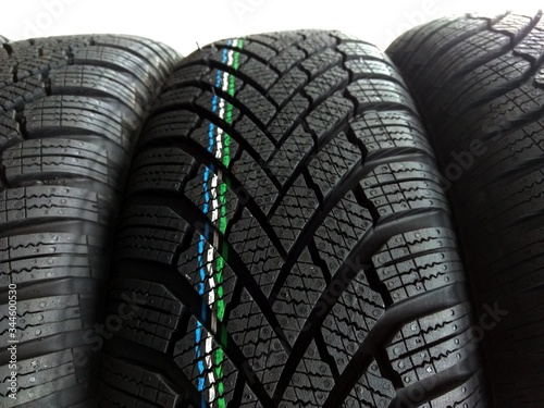 piles of different standard car tires - changing tires
