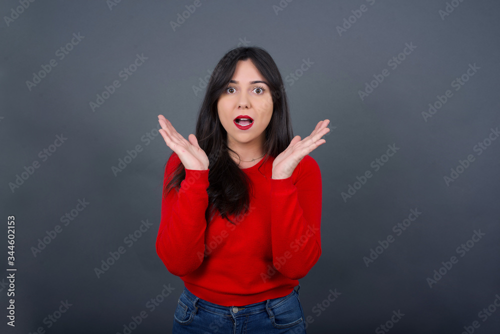 Surprise concept. Portrait of astonished beautiful girl looking surprised in full disbelief wide open mouth with hands near face with braided hair. Positive emotion facial expression body language.