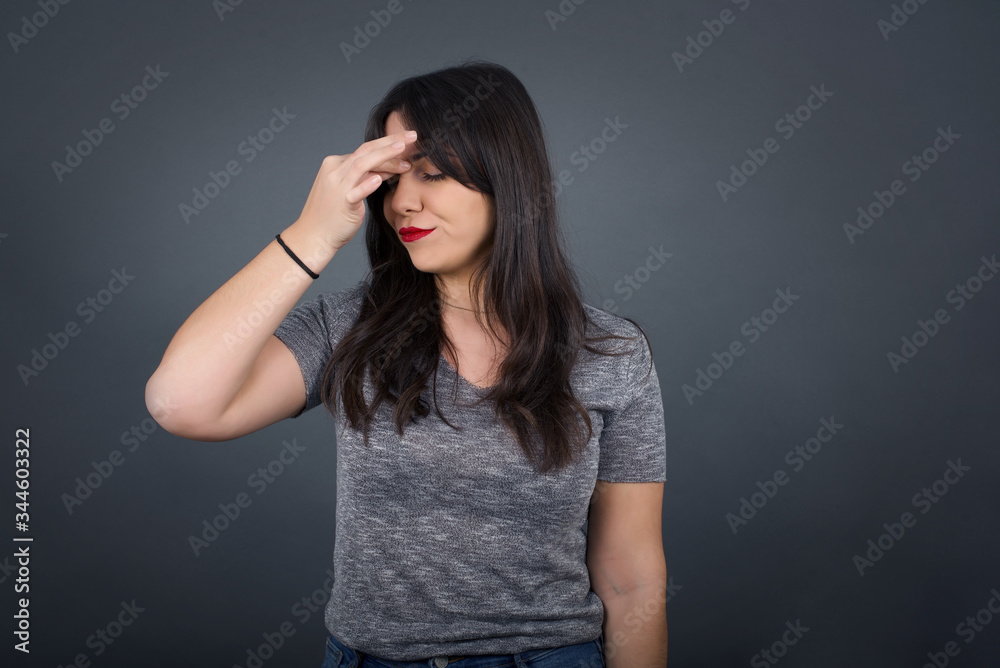 Very upset, charming, nice woman touching nose between closed eyes, want to cry, having stressful relationship, being tired, having troubles with work Very upset, charming, nice woman touching nose between closed eyes, want to cry, having stressful relationship, being tired, having troubles with work