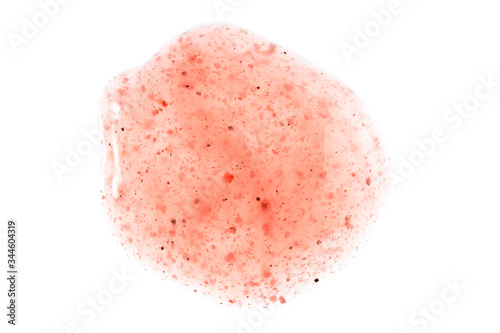 Body and face cosmetic pink swipe. Scrub sample swatch smear drop isolated on white. Peach peeling texture.