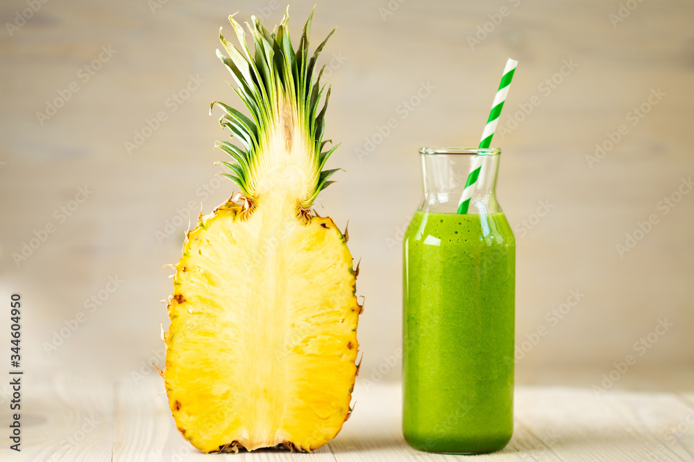 Healthy green smoothie with spinach, banana and pineapple. Raw, vegan, vegetarian, cooking food concept