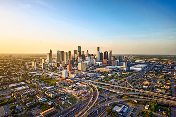Aerial view of downtown Houston, Texas at sunset with highways and skyscrapers