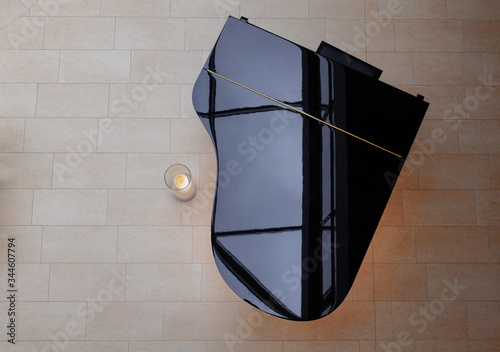 piano with candlelight from above with beautiful warm shine