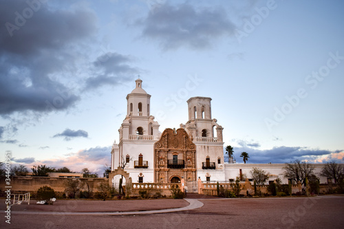 Exterior of Mission San Xavier del Bac against moody sky, Arizona